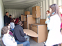 students inside a container they utilized for a recent housing-design project