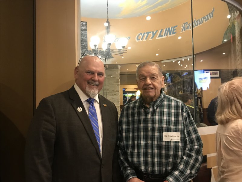 President Sullivan (left) with a man next to him