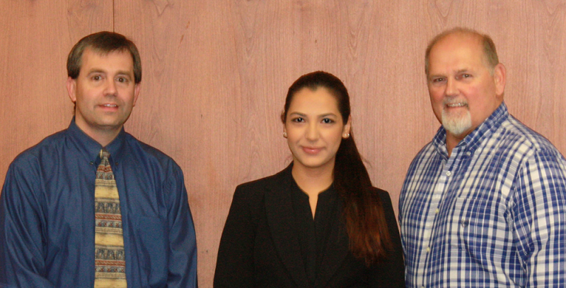 Katherine poses between Jonathan Hilsher and President Dr. Skip Sullivan