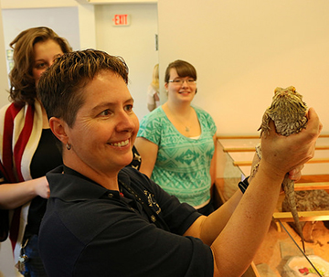 Kathy Bliss holding animal at new vet Center