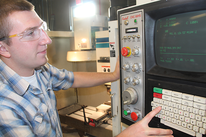 male student looking at a computer screen