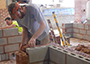 Students take part in the masonry competition during the 2016 SkillsUSA New York State Leadership and Skills Conference Postsecondary Championship