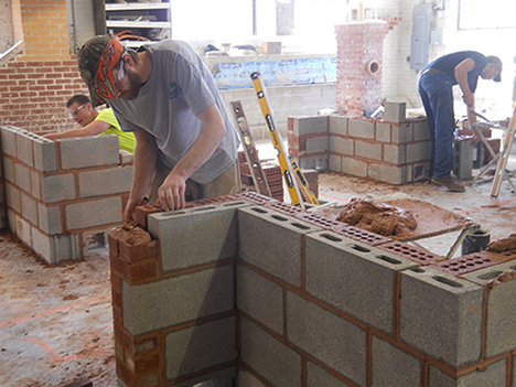 Students take part in the masonry competition during the 2016 SkillsUSA New York State Leadership and Skills Conference Postsecondary Championship