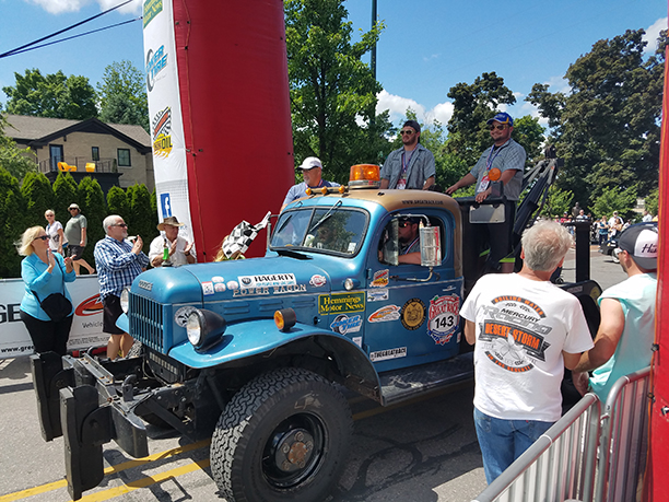 students and truck at the finish line of the 2017 Great Race, along with the college’s president, Dr. Skip Sullivan