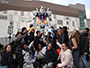 students pictured by the Gundam Statue in Odaiba, Japan