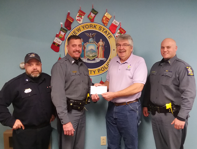 Lt. Scott Bingham presents Rod Ballengee a check, Craig Heller and Kris Bianchi