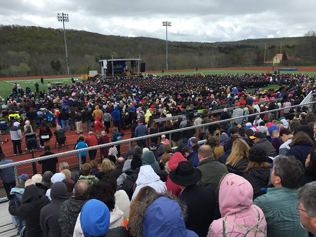 people in Pioneer Stadium attending Commencement