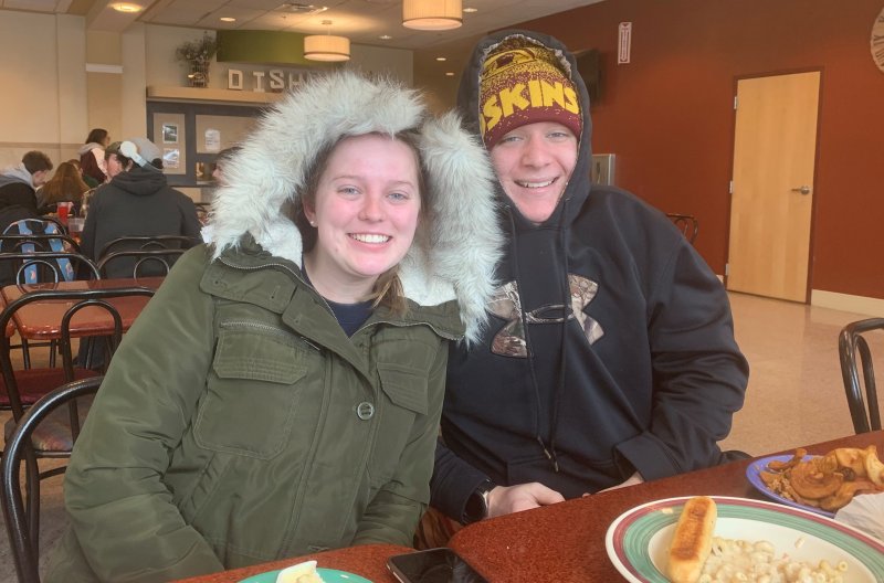 two students sitting at table in CDH