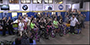 Elk Charity Challenge participants sitting on bikes that they assembled