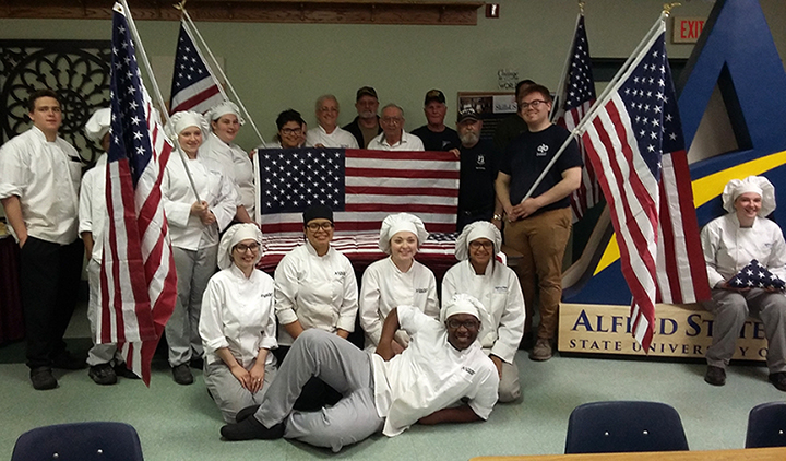 students holding american flags