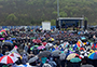 Pioneer Stadium filled with rain ponchos and umbrellas
