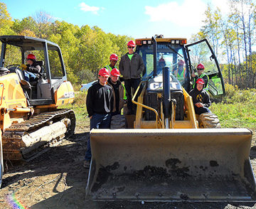 students with heavy equipment