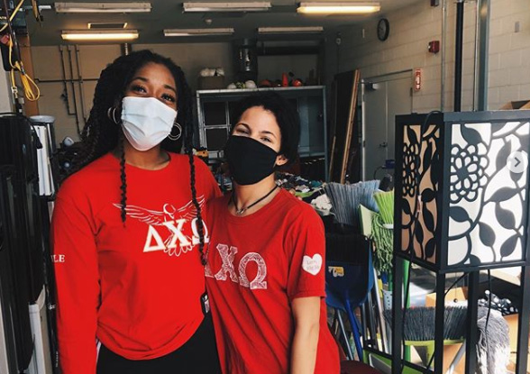 two sorority sisters wearing red t-shirts