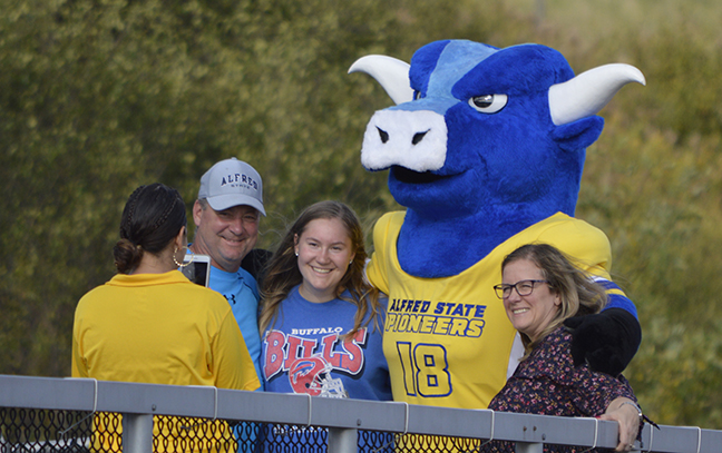 Big Blue poses for pictures with fans during a past Homecoming game.