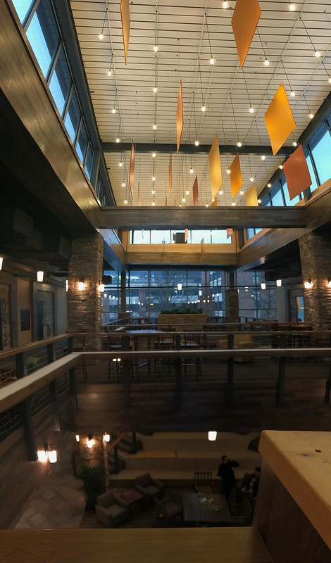 interior image of MacKenzie at night with lights and flags hanging from ceiling