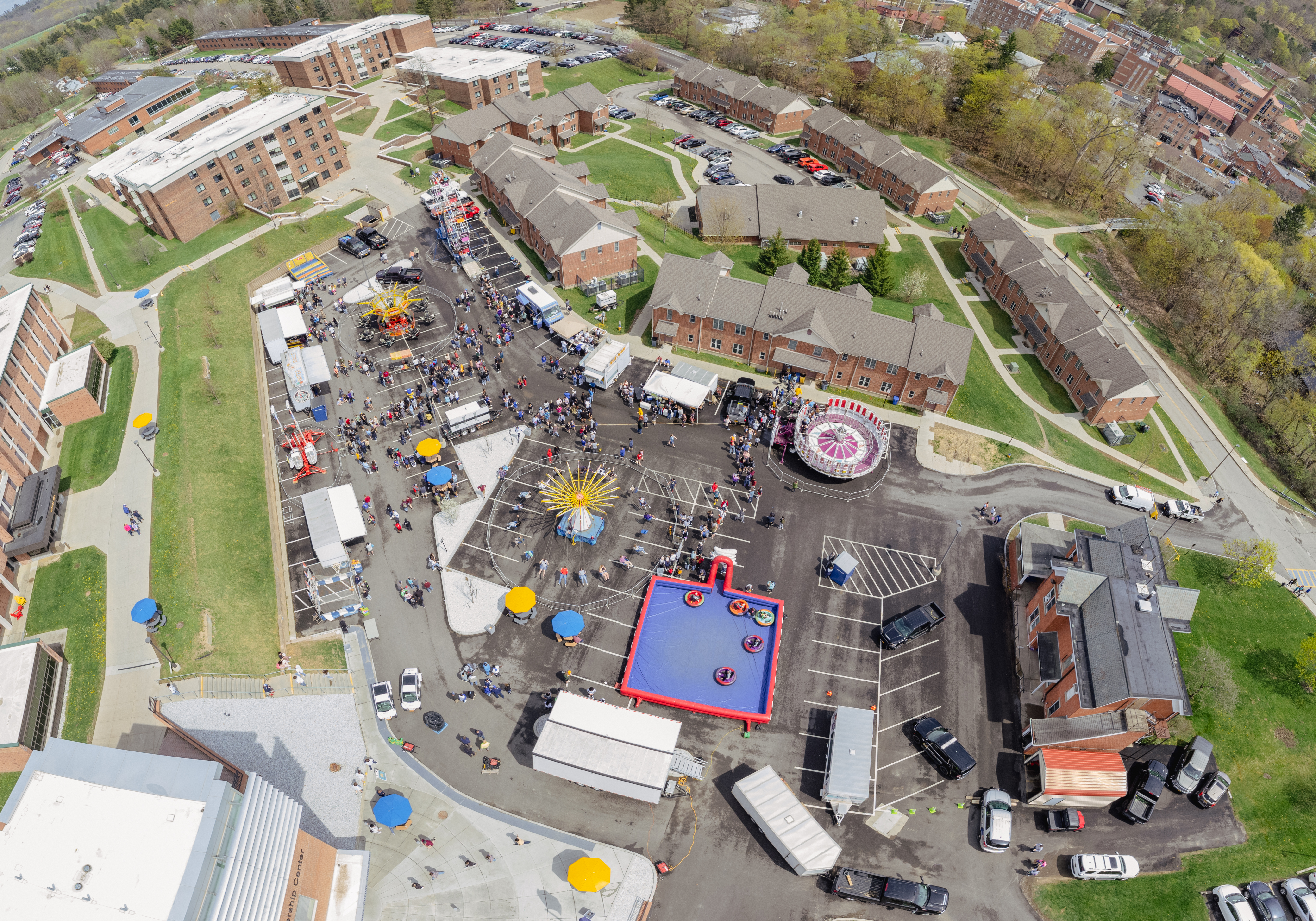 aerial shot of the campus with carnival in parking lot