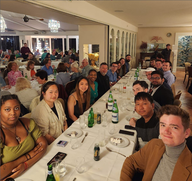 Architecture students share stories about their Italian studies and Neapolitan cuisine with Alfred State College President Dr. Steve Mauro.