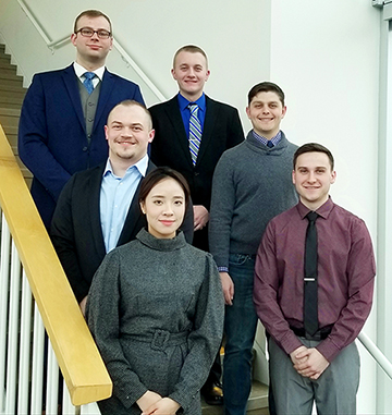 students standing on stairs