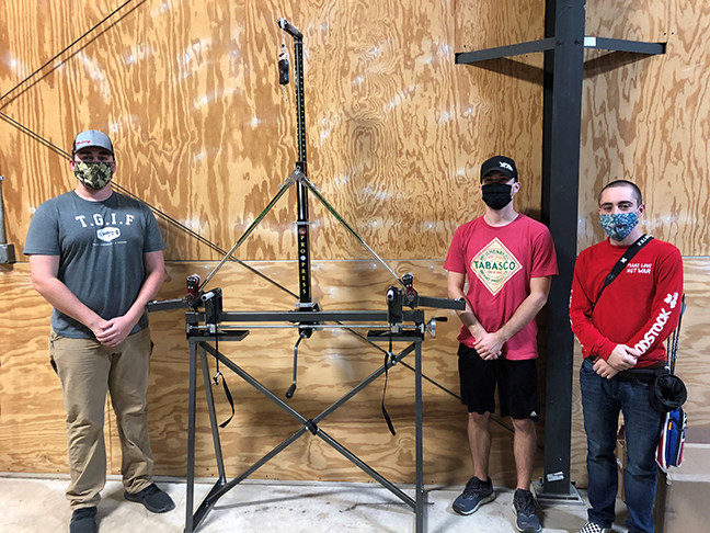 bow press and students standing