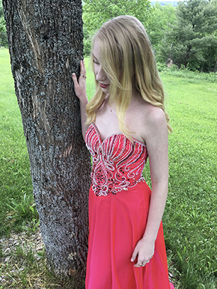 local high-schooler Brooke Shultz in the gown she chose at Project Prom Dress in 2018