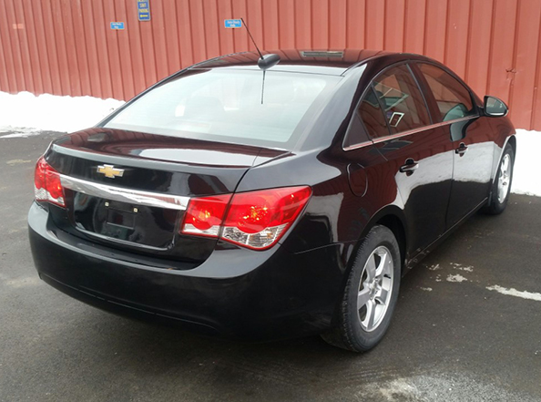 black car with dent fixed on back bumper