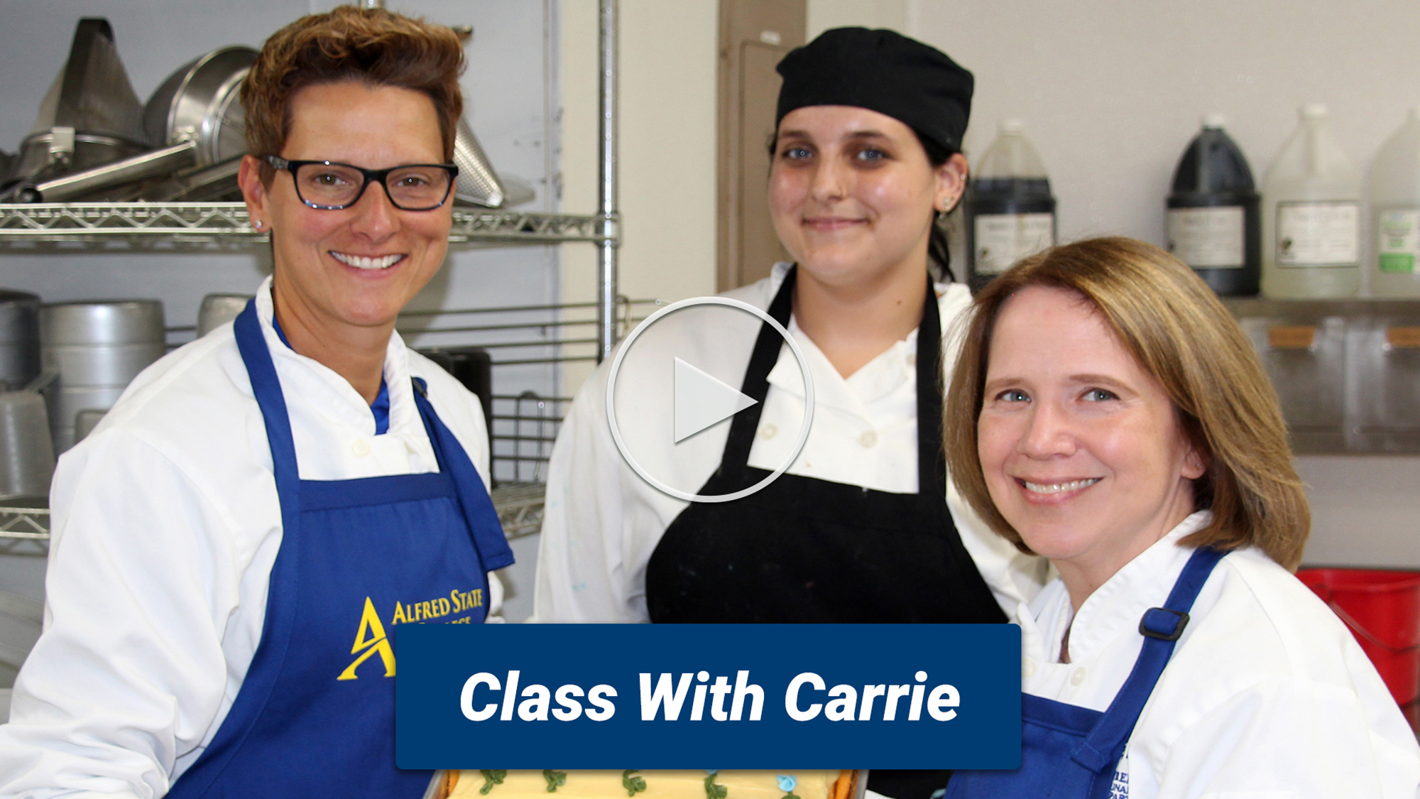 Dr. Carrie Cokely and Kishan Zuber pose with a student after a baking class