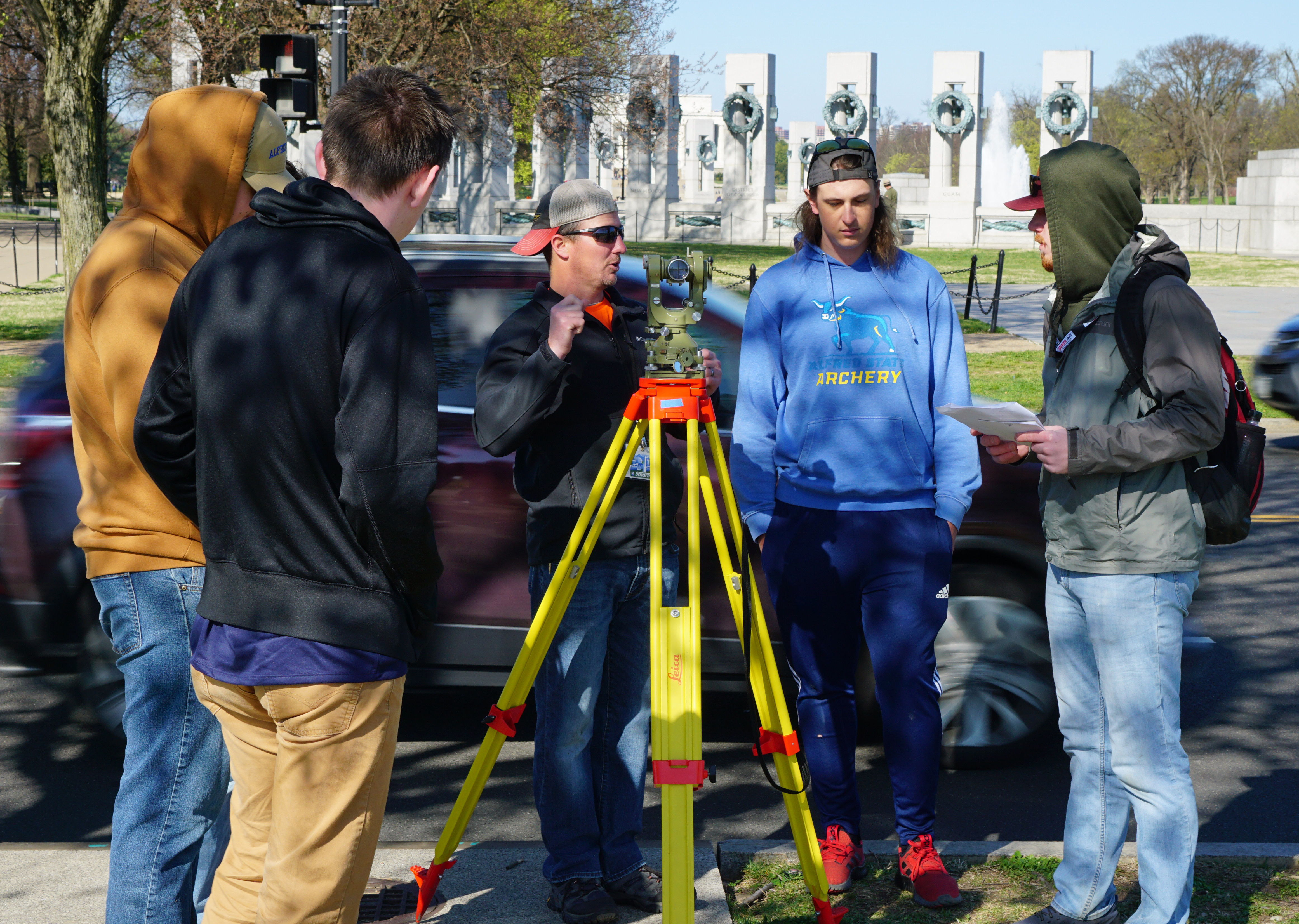 Surveying students work on a project in Washington, D.C.