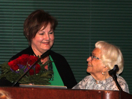 Debbie Sullivan, left, received roses from Mary Huntington