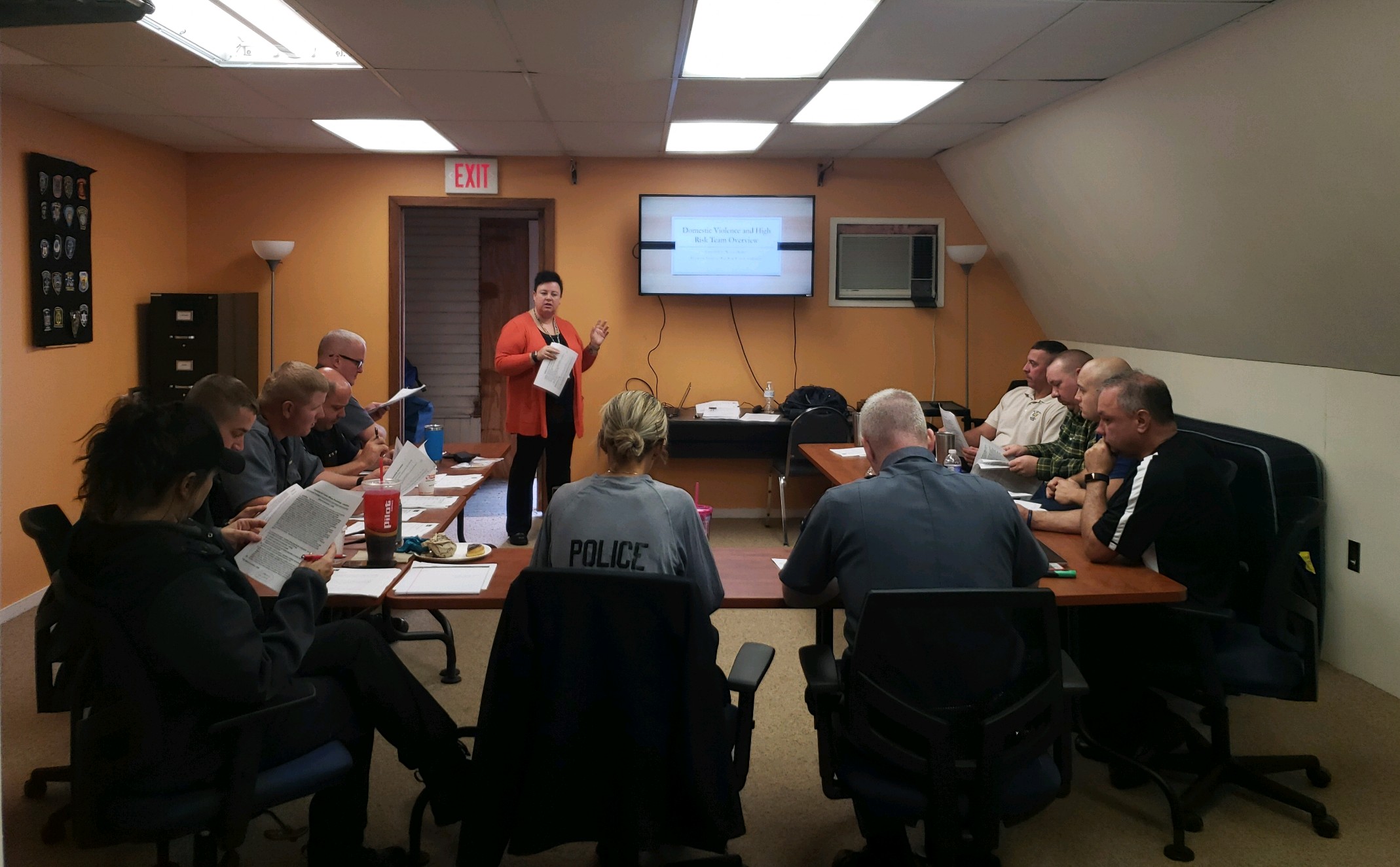 staff around a table at a training session