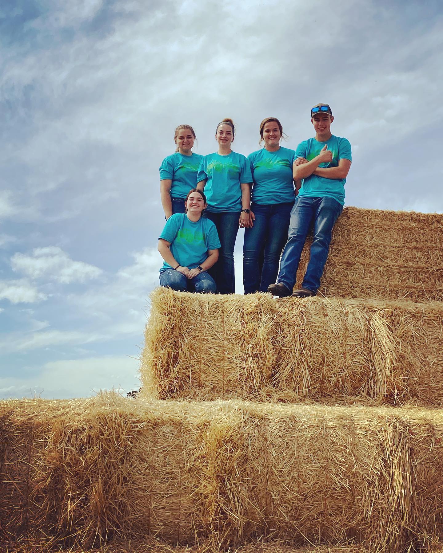 Alfred State agriculture students help at Livingston County Farm Fest (L to R): Hope Avedisian, Elyssa Desotelle (kneeling), Emma Dominic, Abby Beidel, and Tyler Norton.