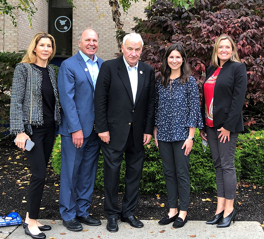 Group picture featuring Tom Golisano and Officer in Charge John Anderson