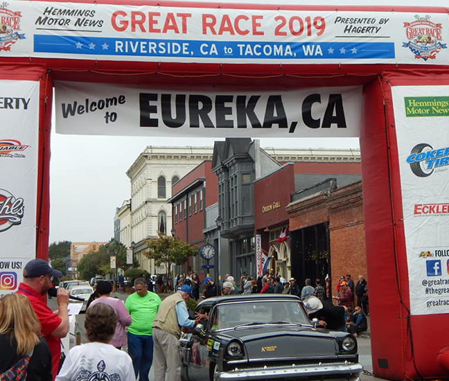 Alfred State’s entry in the 2019 Great Race drives through the arch in Eureka, CA.