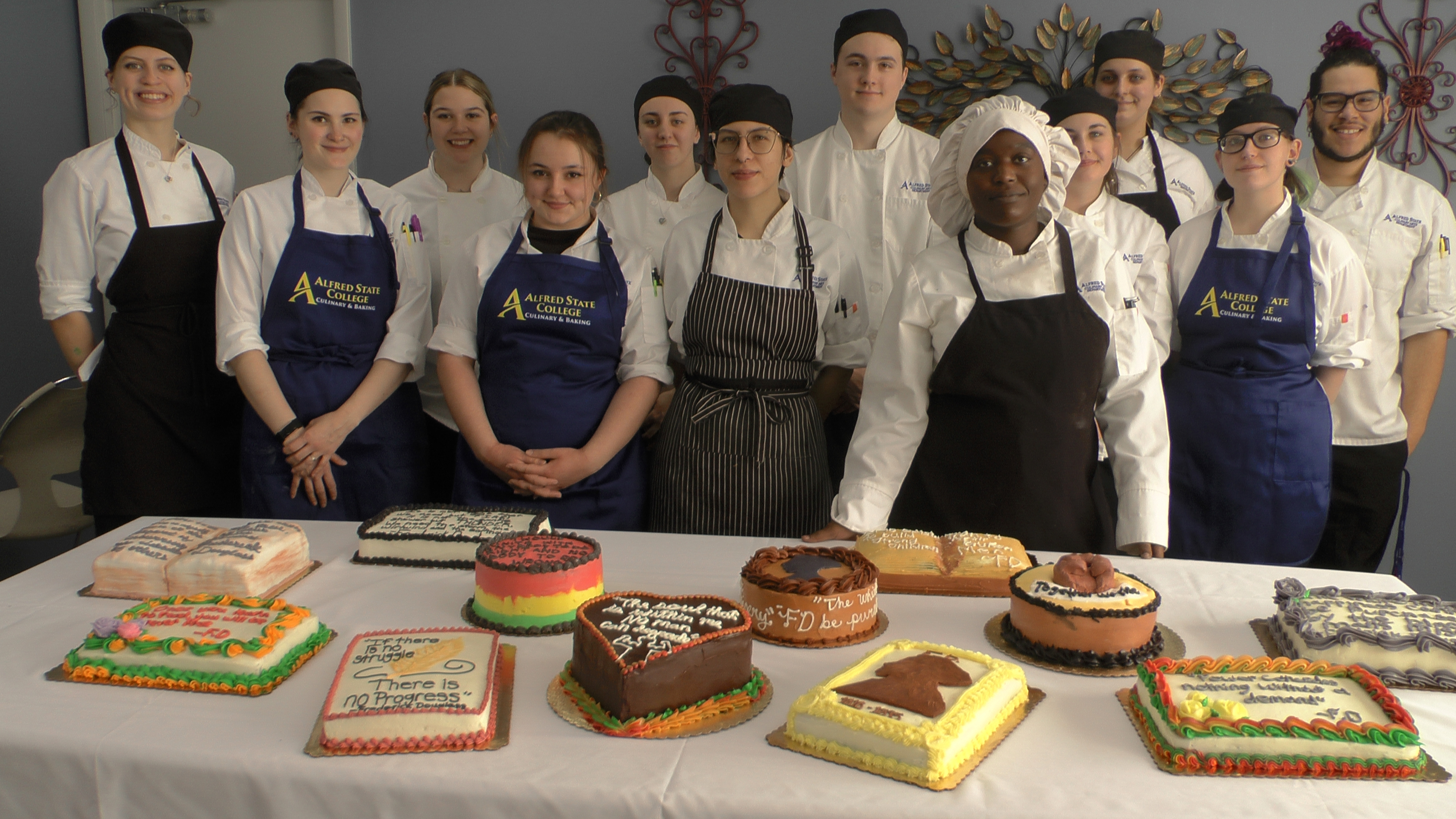 Alfred State Culinary Arts Baking students show off their cakes made for the Douglass Day bake-off