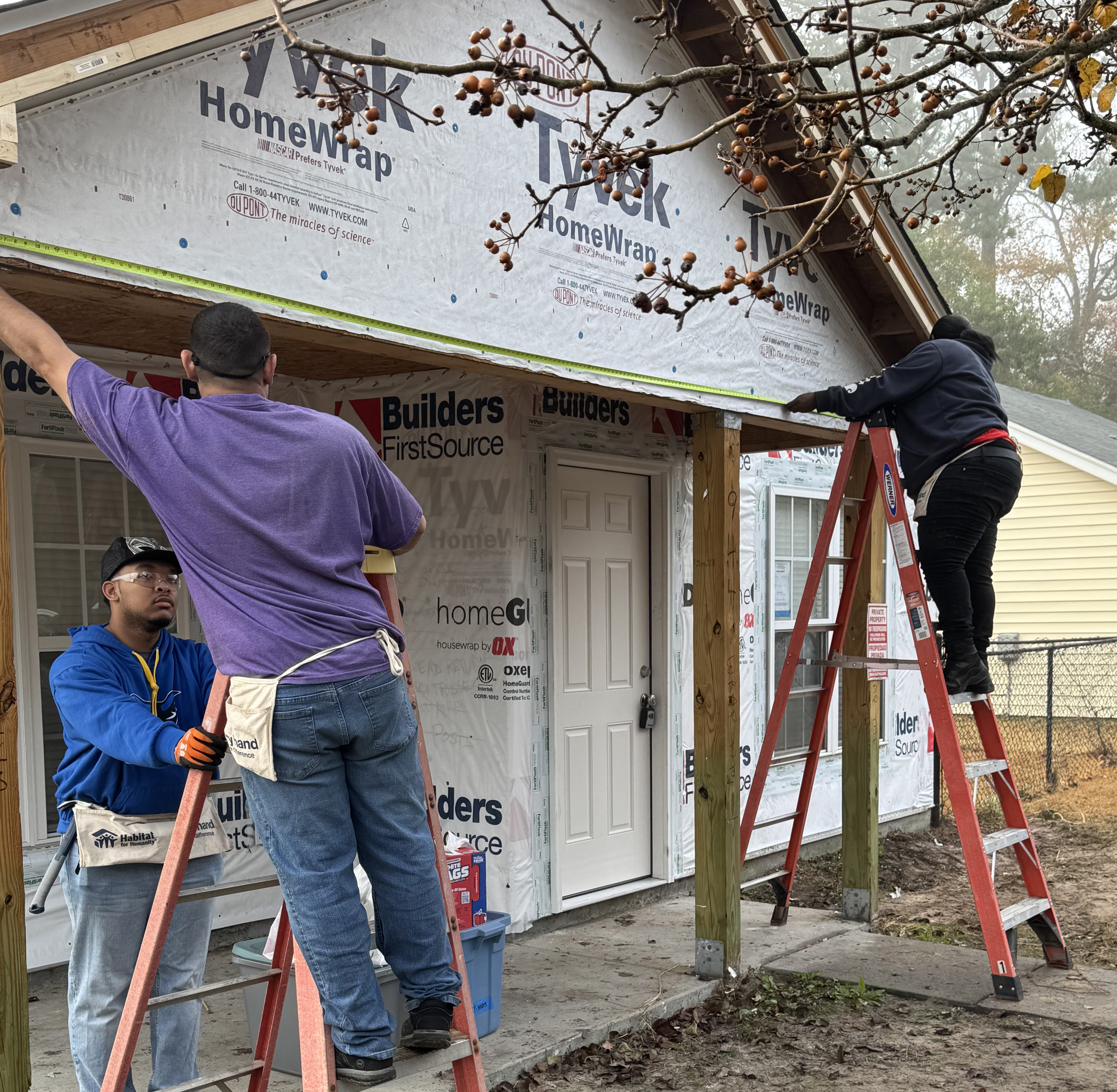 students working on a house