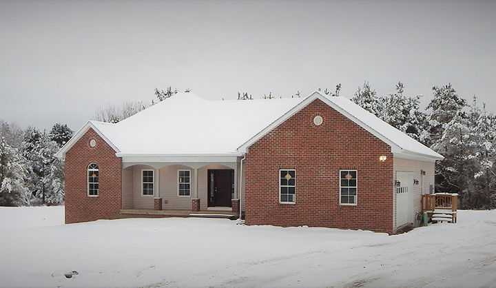 house with snow on the ground