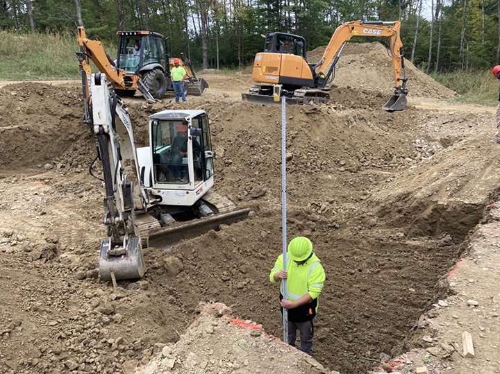 heavy equipment operations student is shown here digging the foundation of the house.