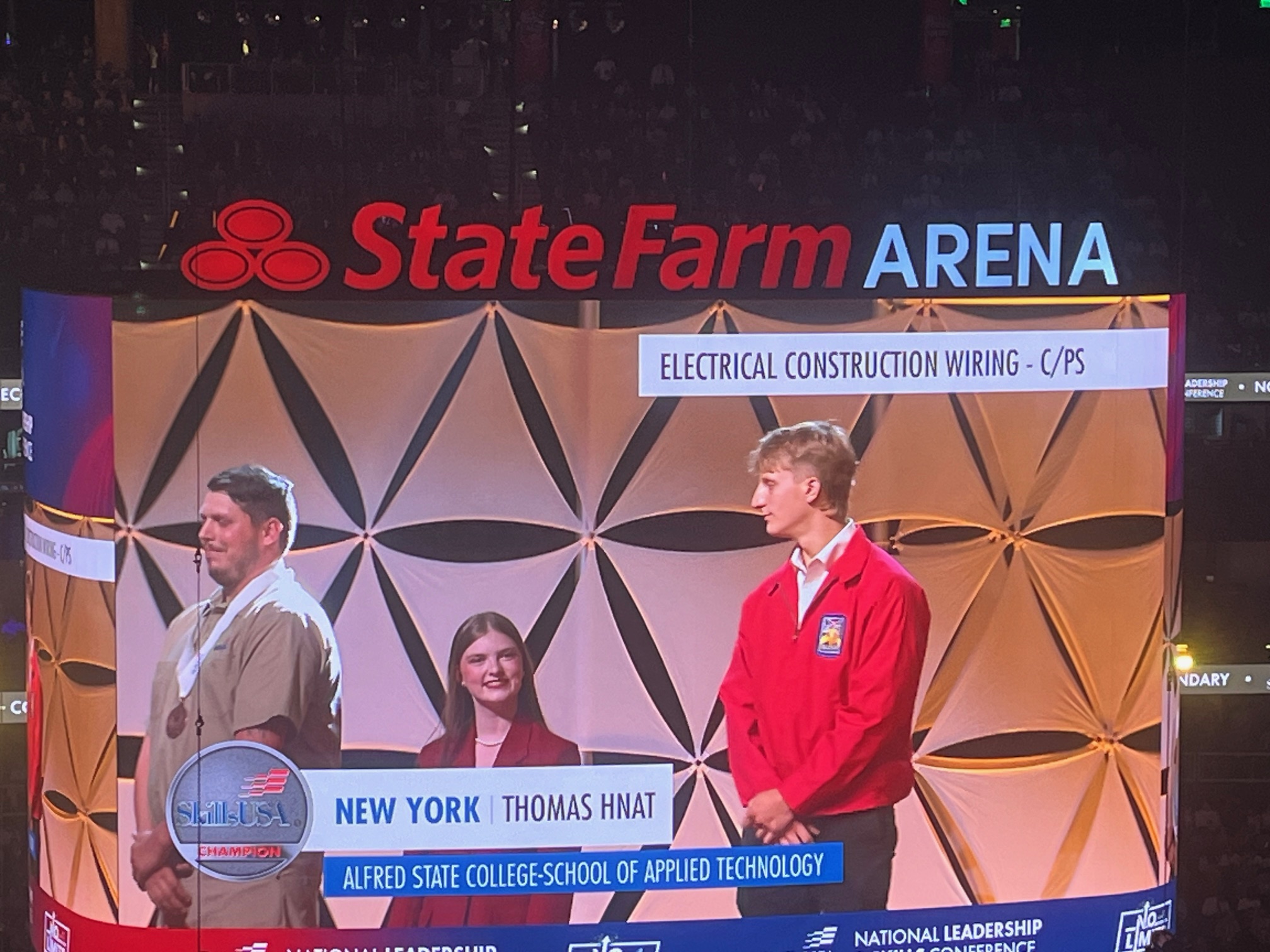 Thomas Hnat accepts his 2nd place award in electrical construction wiring