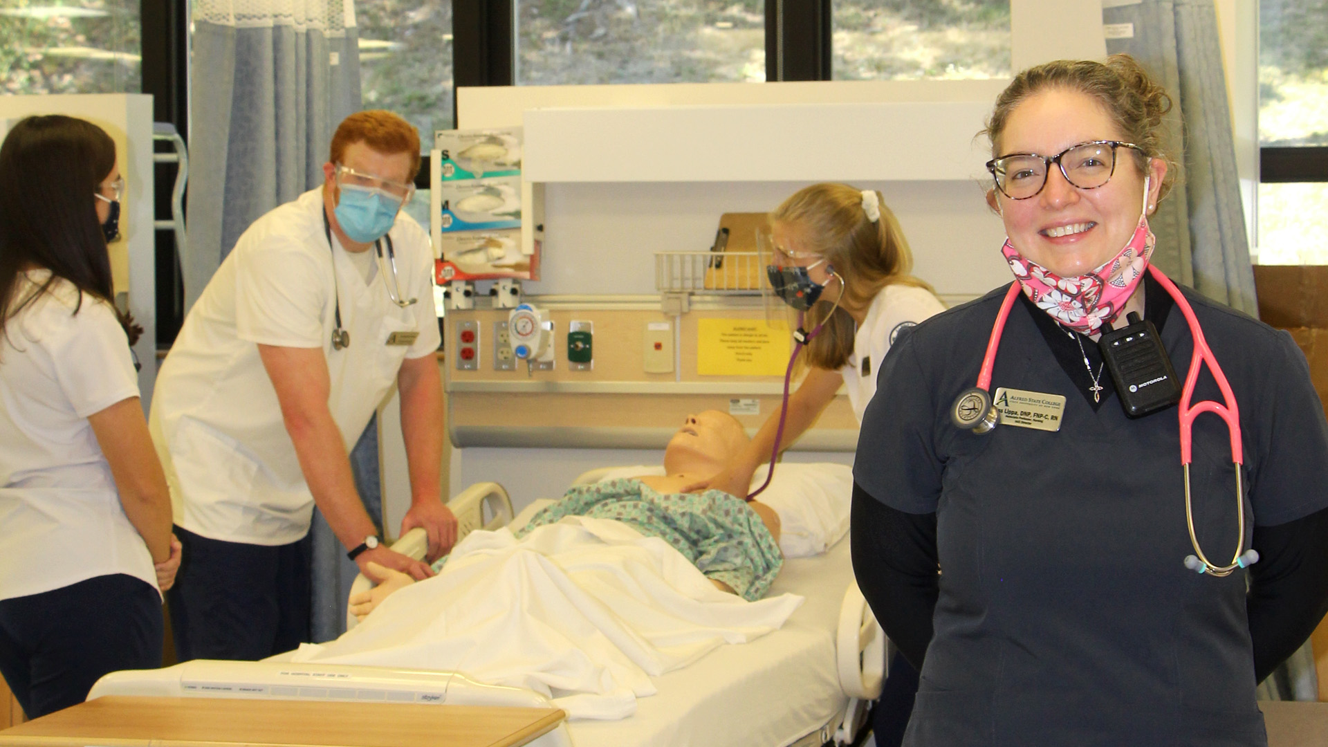 Jess Lippa with nursing students in background