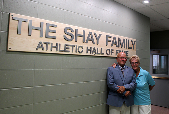 Jon Shay, pictured here with his wife, Linda, at the opening of The Shay Family Athletic Hall of Fame in July 2020