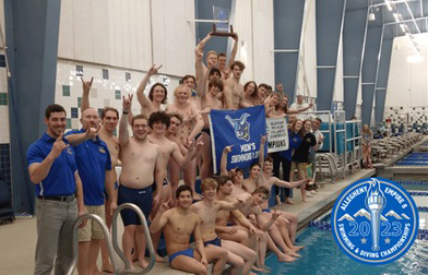 The men's swimming and diving team celebrates their Allegheny Empire 8 Championship on the award stand.