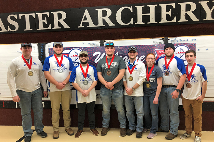 several students wearing their medals