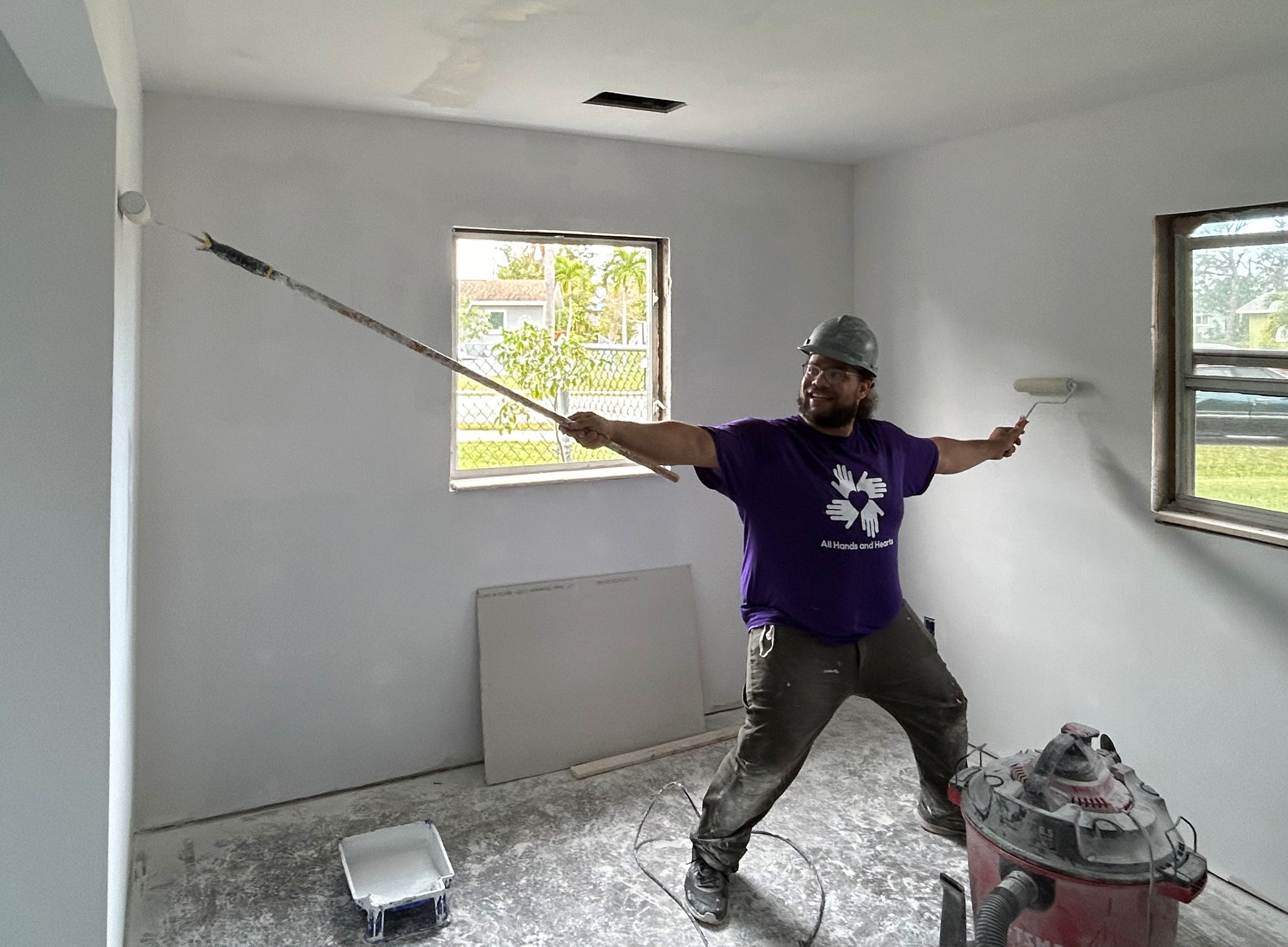 A student paints a room