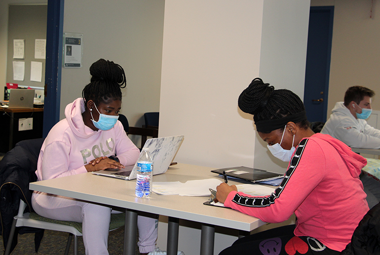 Students working on homework together in the Student Success Center.