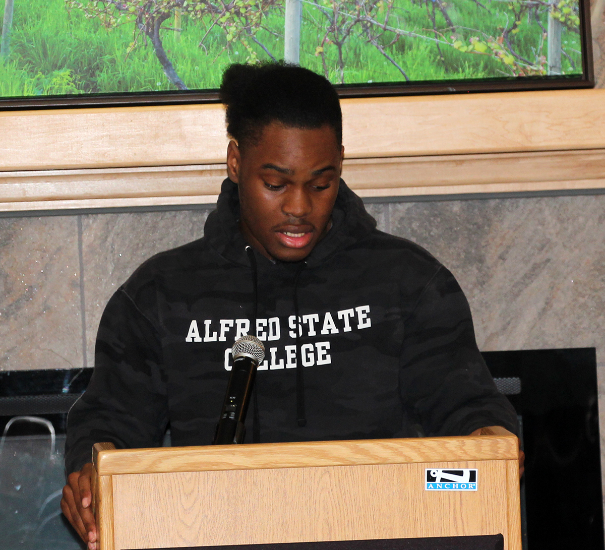 An Alfred State student recites a poem.
