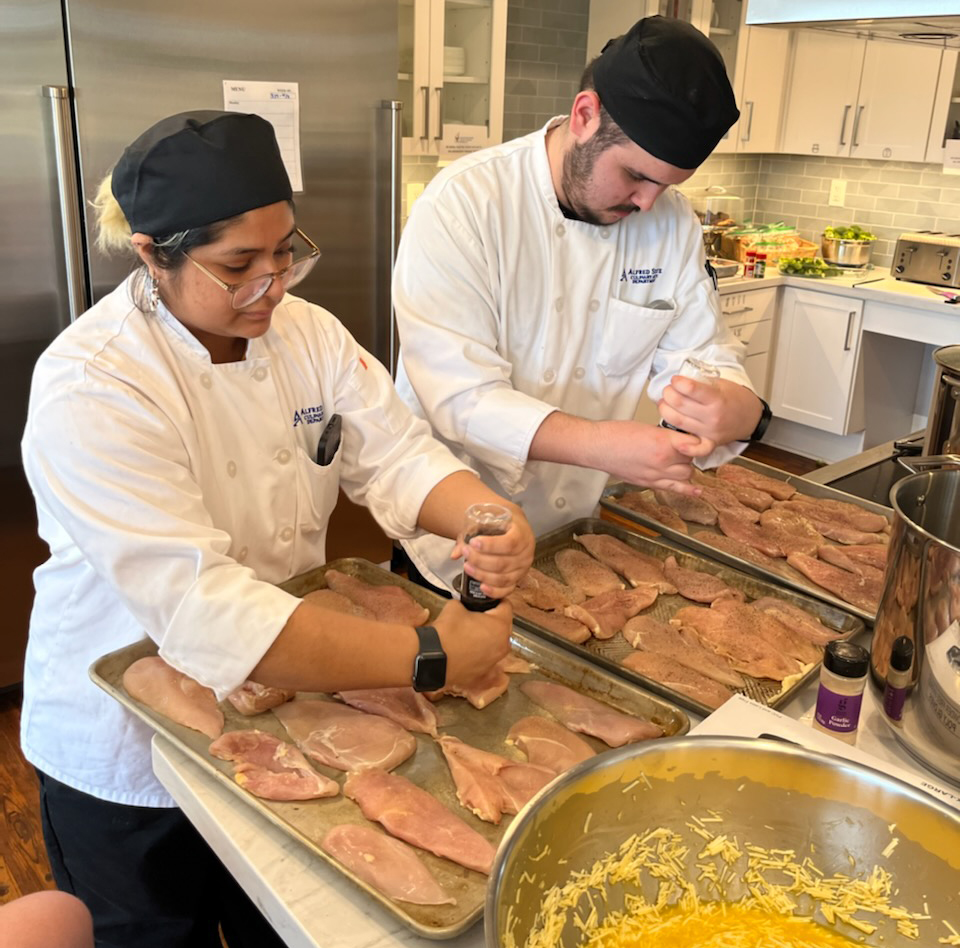 Culinary arts students prepare dinner at the Ronald McDonald House.