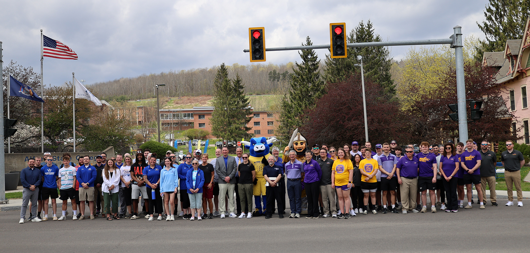 Alfred State and Alfred University coaches gather at the stoplight