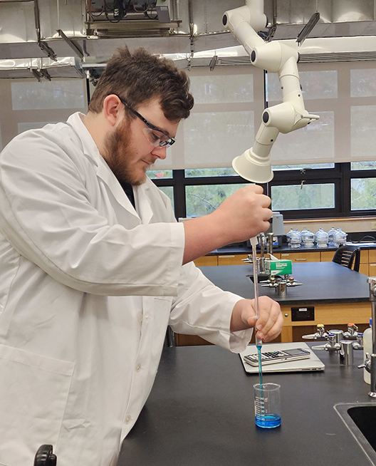 An Alfred State student works in a lab. Alfred State ranks high with health, science, and human services majors.