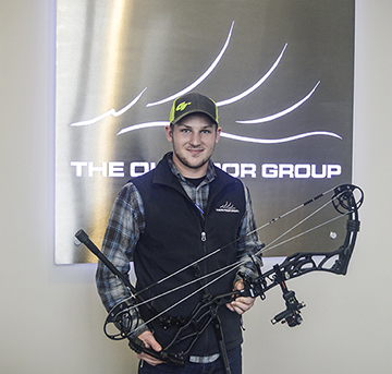 Trystan Duell holding archery equipment