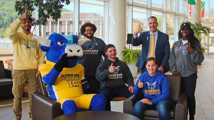 Dr. Mauro celebrates with students and Big Blue the mascot as US News again ranks Alfred State the #1 SUNY regional college. 