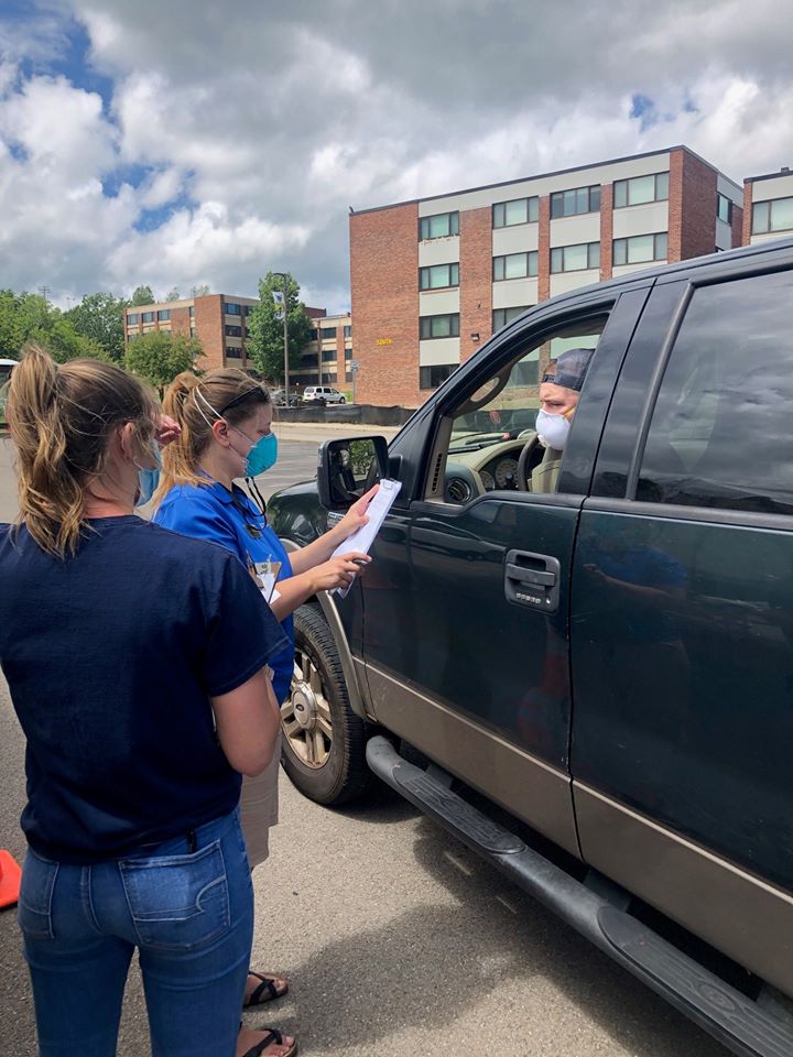 Alfred State employees administer a screening process as students begin returning to campus.